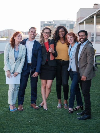 Group of workers together taking a corporate team photo. Concept: Business, colleagues, friendship